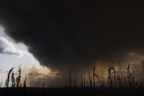 Wildfires burning across central Canada force more people to evacuate