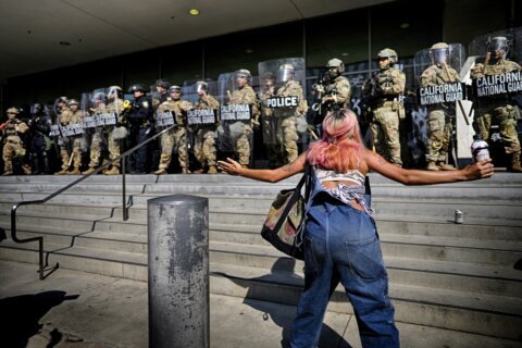 The Latest: Trump defends National Guard deployment as protests spread to other cities